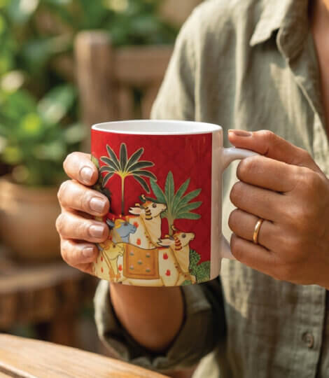 Premium Ceramic Coffee and Tea Mug – Traditional Indian Pichwai Art with Herd of Cows and Trees on Plum Red Background